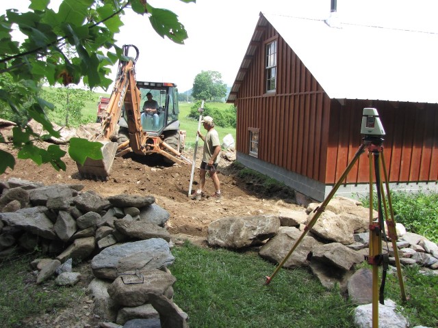 Measuring to make sure the foundation is level.