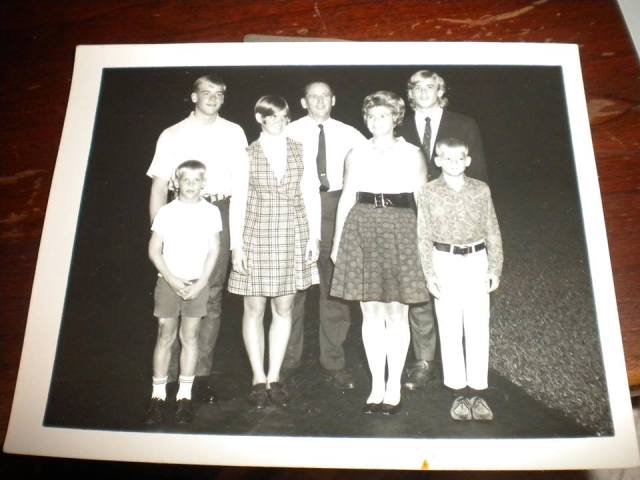 John is at bottom left, behind him Al, then Mary, his dad and mom, and Art standing behind Eddie.